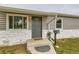 Close up of home entry featuring newly installed gray siding and painted door at 9470 Lillian Ln, Thornton, CO 80229