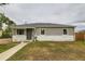 Charming ranch-style home featuring stone accents, new siding, and a well-maintained front lawn at 9470 Lillian Ln, Thornton, CO 80229