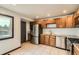 Updated kitchen with stainless steel appliances, gas range, and granite countertops at 9470 Lillian Ln, Thornton, CO 80229