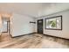 Open concept living room with new floors and updated wall paint at 9470 Lillian Ln, Thornton, CO 80229