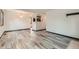 Spacious open floor plan with light colored floors and views of adjoining rooms at 9470 Lillian Ln, Thornton, CO 80229
