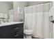 Bright bathroom with a vanity, framed mirror, and a shower with curtain rod at 10700 Kimblewyck Cir # 154, Northglenn, CO 80233