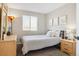 This cozy bedroom features a soft carpet, a large window, and wooden dressers at 10700 Kimblewyck Cir # 154, Northglenn, CO 80233