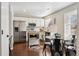 Well-lit kitchen featuring stainless steel appliances, a breakfast nook, and white cabinetry at 10700 Kimblewyck Cir # 154, Northglenn, CO 80233