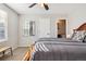 Serene bedroom featuring a comfortable bed, a mirror, and a view into the connected bathroom at 10700 Kimblewyck Cir # 154, Northglenn, CO 80233