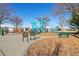 Community playground featuring modern blue climbing structures and recreational space for outdoor activity at 10700 Kimblewyck Cir # 154, Northglenn, CO 80233