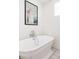 Elegant bathroom showcasing a soaking tub, vintage-style faucet, and clean design for relaxation at 1010 N Jasmine St, Denver, CO 80220