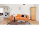 Bright living room features stylish decor, hardwood floors, and comfortable seating for a relaxing atmosphere at 1010 N Jasmine St, Denver, CO 80220