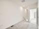 Bright hallway with carpeted floor and access to other rooms at 14556 W 91St Ave # C, Arvada, CO 80005