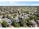 Aerial view showcasing the neighborhood with well-maintained homes and community landscaping at 20234 E Lake Cir, Centennial, CO 80016