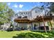 Spacious backyard with multiple decks and seating areas for outdoor enjoyment at 20234 E Lake Cir, Centennial, CO 80016