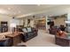 Open basement layout featuring cozy seating area and custom bar for relaxation at 20234 E Lake Cir, Centennial, CO 80016