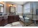 Luxurious bathroom with double vanity, soaking tub, glass shower, and natural light at 20234 E Lake Cir, Centennial, CO 80016