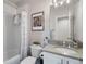 Well-lit bathroom features a shower-tub combo, vanity, and modern fixtures at 20234 E Lake Cir, Centennial, CO 80016