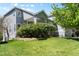 This two-story home boasts a well-maintained lawn and mature trees, showcasing its charming curb appeal at 20234 E Lake Cir, Centennial, CO 80016