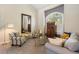 Bright living room featuring neutral walls, and a large mirror that enhances the light and space at 20234 E Lake Cir, Centennial, CO 80016