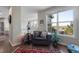 Cozy loft area featuring a comfortable chair, a window with a scenic view, and a reading lamp at 20234 E Lake Cir, Centennial, CO 80016