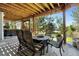 Covered patio with a dining table, chairs, built in benches, and backyard access at 20234 E Lake Cir, Centennial, CO 80016