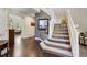 Inviting staircase featuring carpeted steps and white banisters at 20234 E Lake Cir, Centennial, CO 80016