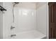 Bathroom featuring a white shower and bronze fixtures at 8346 W Woodard Dr, Lakewood, CO 80227