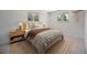 Bedroom with decor featuring carpeted floors and natural light from two windows at 8346 W Woodard Dr, Lakewood, CO 80227