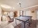 Finished basement featuring a ping pong table and comfortable seating area at 3002 E Long S Cir, Centennial, CO 80122