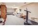 Spacious finished basement with ping pong table, seating, and treadmill at 3002 E Long S Cir, Centennial, CO 80122