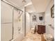 Well-lit bathroom with a shower and vanity sink at 3002 E Long S Cir, Centennial, CO 80122