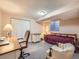 Cozy bedroom with a comfortable chair and a work desk at 3002 E Long S Cir, Centennial, CO 80122