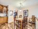 Elegant dining area with wood floors, wine rack and seating for six at 3002 E Long S Cir, Centennial, CO 80122