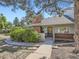 Charming single-Gathering home with a brick chimney, walkway, and well-maintained landscaping at 3002 E Long S Cir, Centennial, CO 80122