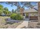 Charming single-Gathering home with a brick chimney, walkway, and well-maintained landscaping at 3002 E Long S Cir, Centennial, CO 80122