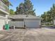 Detached garage with a grey door at 3002 E Long S Cir, Centennial, CO 80122