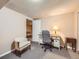 Comfortable office space with a desk, chair, and an adjacent recreational space at 3002 E Long S Cir, Centennial, CO 80122