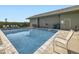Community swimming pool surrounded by lounge chairs and lush landscaping at 3002 E Long S Cir, Centennial, CO 80122