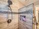 Modern tiled shower with dual shower head and built-in niche at 3002 E Long S Cir, Centennial, CO 80122