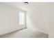 Light-filled bedroom features neutral carpet, white walls, and a window for plenty of sunlight at 20665 E 57Th Dr, Aurora, CO 80019