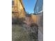 Backyard showing a wooden fence and minimal landscaping between houses at 3903 S Quemoy Ct, Aurora, CO 80018