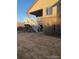 Backyard featuring a wooden deck with stairs leading down to the lawn at 3903 S Quemoy Ct, Aurora, CO 80018