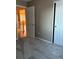 A neutral bedroom with an open doorway and an adjoining closet at 3903 S Quemoy Ct, Aurora, CO 80018