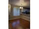 Inviting dining area with hardwood floors adjacent to the kitchen area and great natural light at 3903 S Quemoy Ct, Aurora, CO 80018