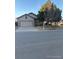Charming single-story house featuring an attached garage and well-maintained front yard at 3903 S Quemoy Ct, Aurora, CO 80018