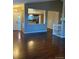 Open-concept living area showing the kitchen, hardwood floors, and plenty of natural light at 3903 S Quemoy Ct, Aurora, CO 80018