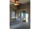 Spacious main bedroom with neutral carpeting, and a bright ensuite bathroom at 3903 S Quemoy Ct, Aurora, CO 80018