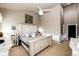 Inviting bedroom with a vaulted ceiling, cozy decor, and plenty of natural light at 11699 Pink Phlox Dr, Parker, CO 80134
