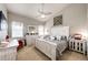Inviting bedroom with a vaulted ceiling, cozy decor, and plenty of natural light at 11699 Pink Phlox Dr, Parker, CO 80134