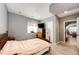 Cozy bedroom with hardwood floors, a wooden dresser, and soft, neutral tones at 11699 Pink Phlox Dr, Parker, CO 80134