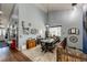 Charming dining room with high ceilings, a decorative light fixture, and access to the staircase at 11699 Pink Phlox Dr, Parker, CO 80134