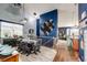 Charming dining room with high ceilings, a decorative light fixture, and access to the living room at 11699 Pink Phlox Dr, Parker, CO 80134