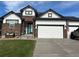 Attractive home with a blend of stone and siding, plus a large garage at 11699 Pink Phlox Dr, Parker, CO 80134